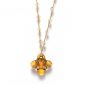 Gioiello di elegante geometria ornata di un pendaglio Pendant Cross Tribe dalla colorazione Topaz Dorado ideata da Céline Cousteau per Swarovski.